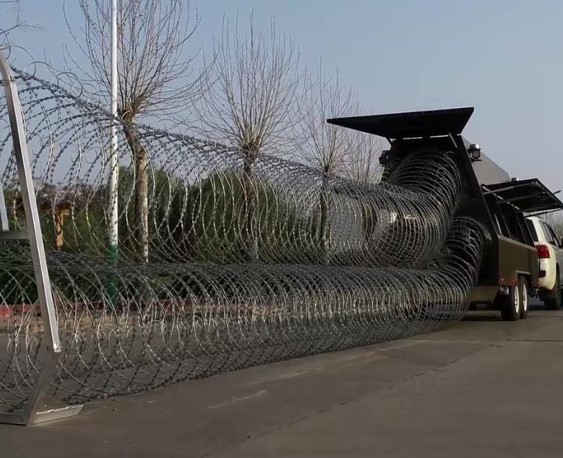 Mobile barriers are used for crowd control, riot prevention, protection of critical infrastructure, temporary site perimeter security and areas where an aggressive rapid deployment barrier is required for the protection of people and property.

The system is designed to provide rapid deployment of 75–300 meters of barbed tape/razor wire coils, which can be deployed and recovered automatically. The mobile barrier deploys 75–300 meters of three-coil razor wire in seconds.

Mobile security razor barriers are fully recoverable and reusable.

A trailer comes complete with:

Necessary PPE
All electronics for retrieval and barrier compaction
300m cartridge of three-coil razor wire
Protective 20-foot shipping container
Operation manuals
